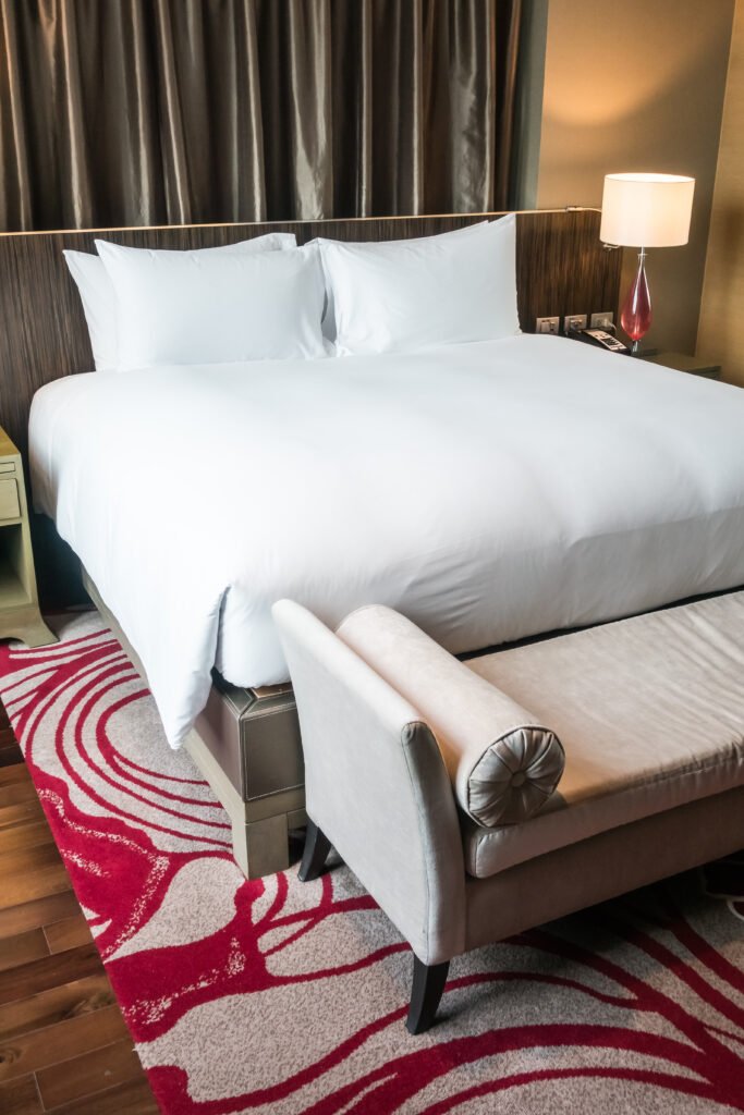 White Pillow on bed with table light lamp decoration in bedroom interior